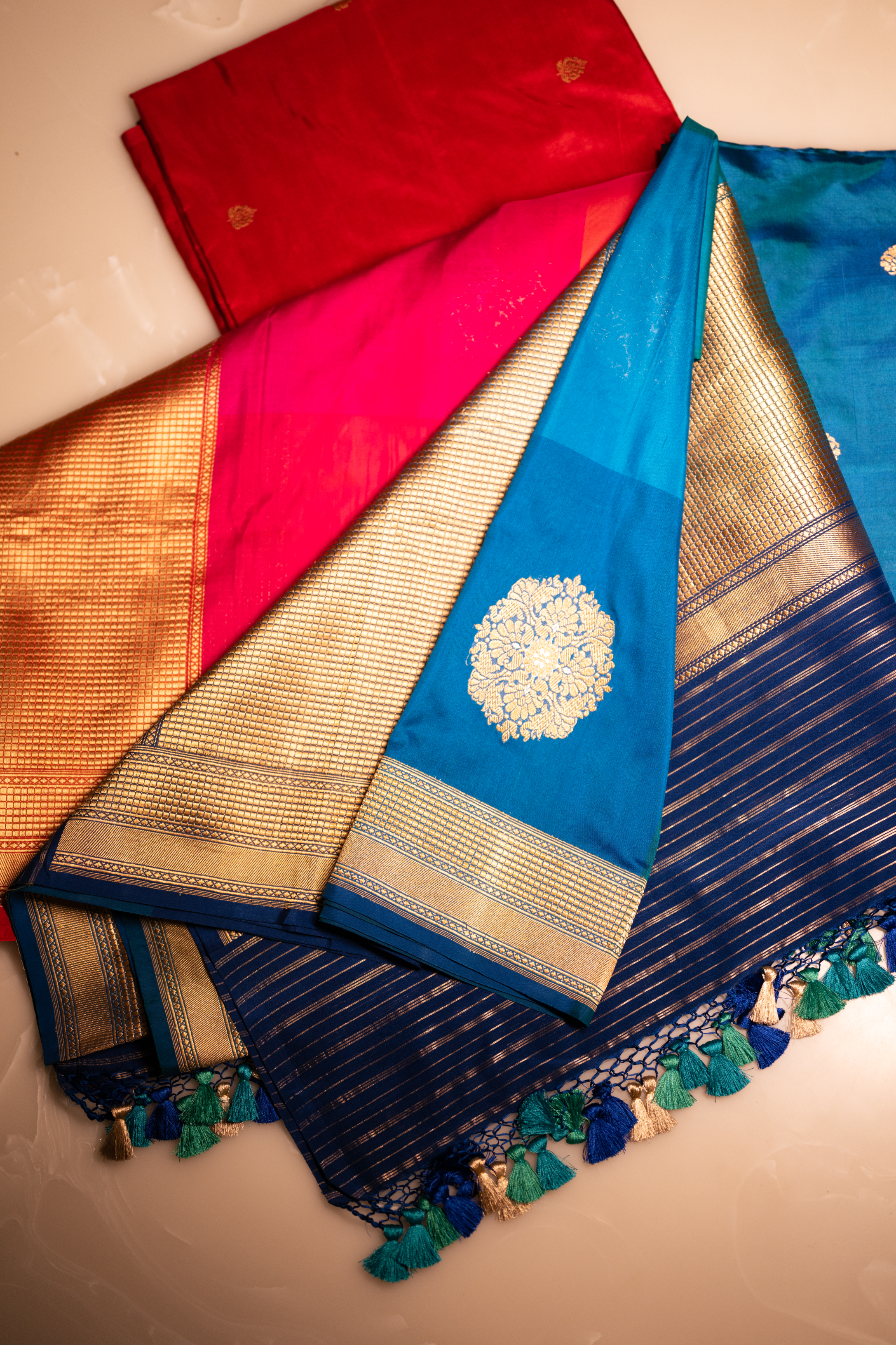 Handwoven Banarasi Katan silk suit with rich zari borders and elegant woven detailing.