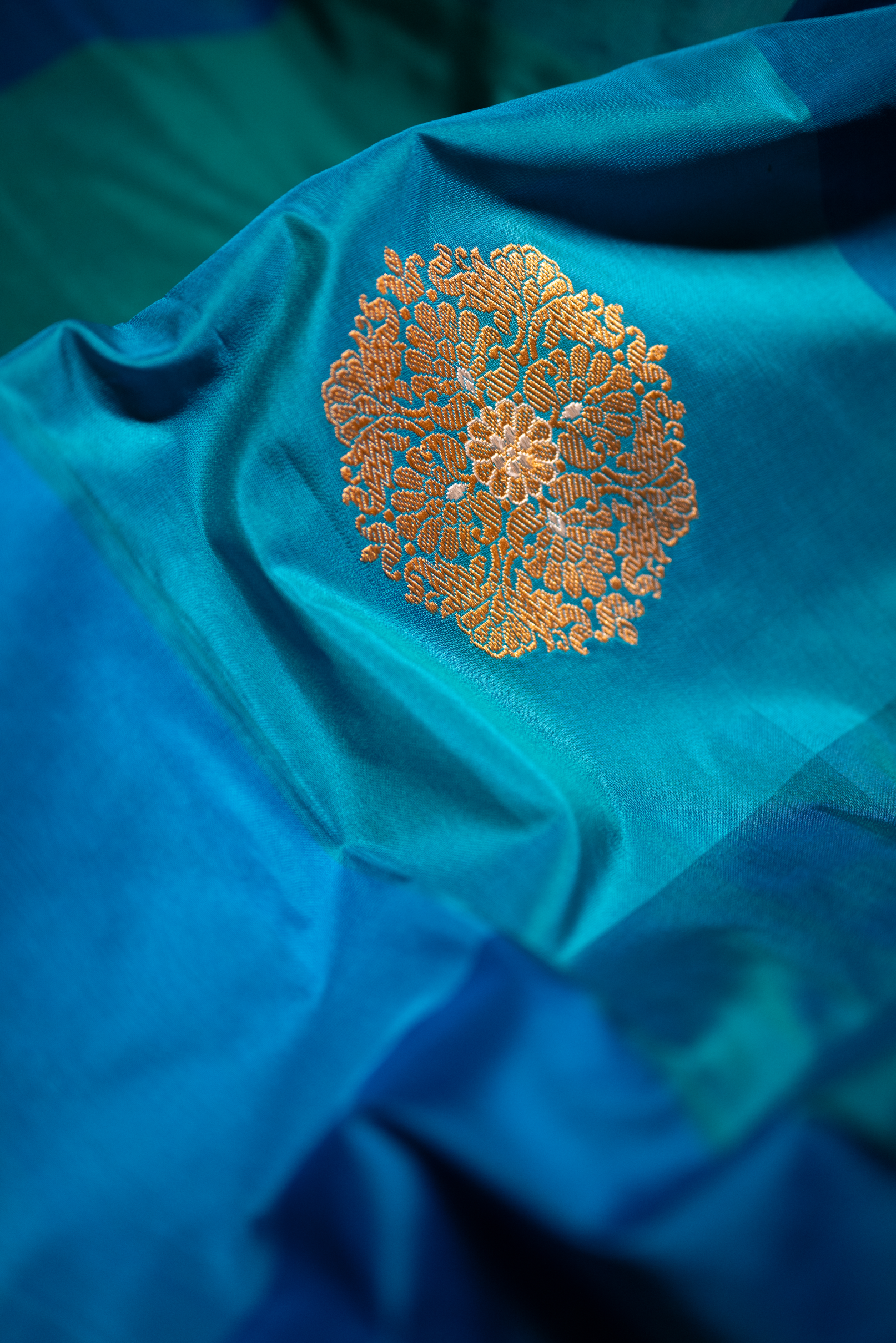 Handwoven Banarasi Katan silk suit with rich zari borders and elegant woven detailing.