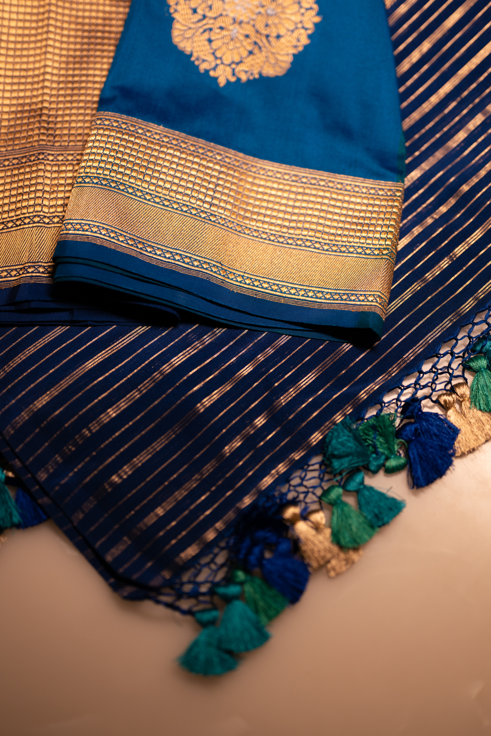 Handwoven Banarasi Katan silk suit with rich zari borders and elegant woven detailing.