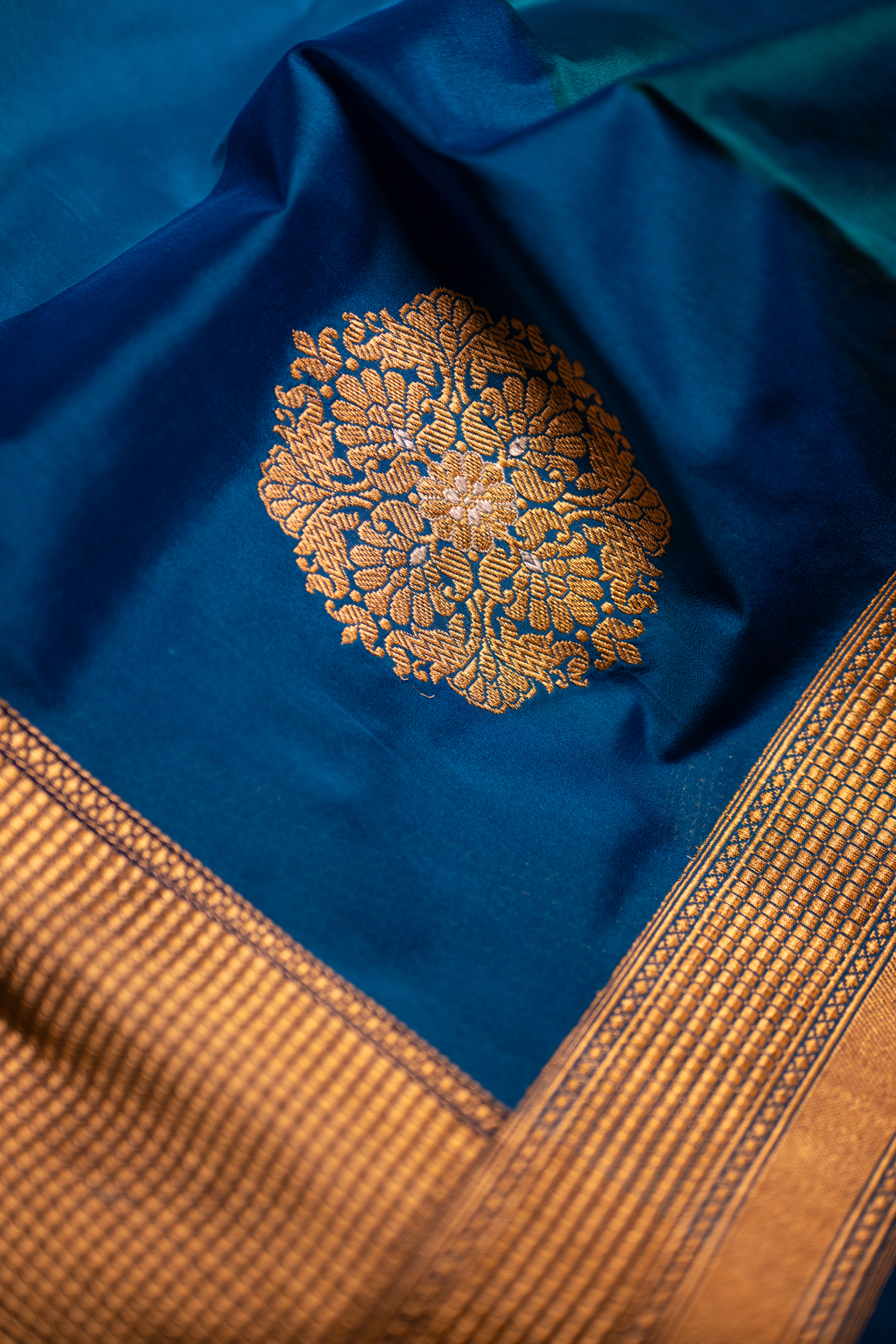 Handwoven Banarasi Katan silk suit with rich zari borders and elegant woven detailing.