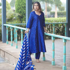 Close-up detail of gold and silver Sona Rupa small boota embroidery on pure blue Banarasi silk fabric.