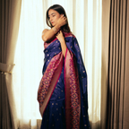 Handwoven Banarasi silk saree with Patola pallu and heavy border with contrast fuchsia blouse