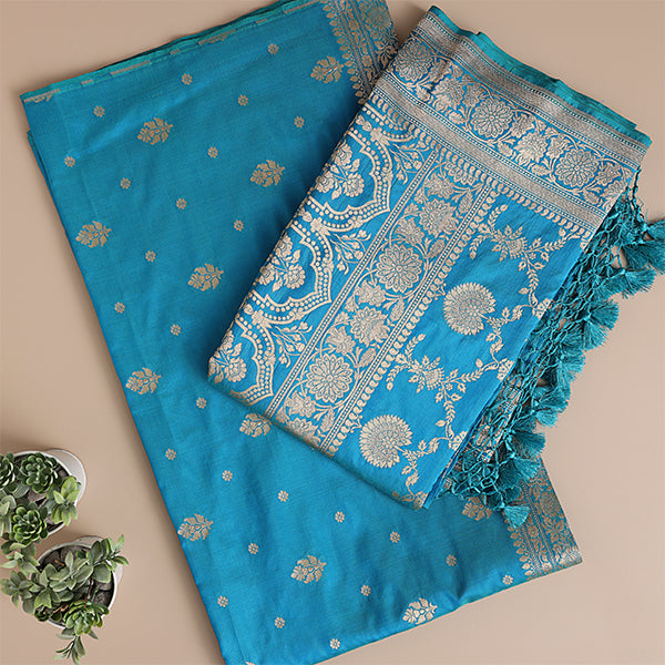 Close-up view of the premium aqua blue Banarasi silk fabric, highlighting the exquisite traditional neck pattern and fine handloom craftsmanship.