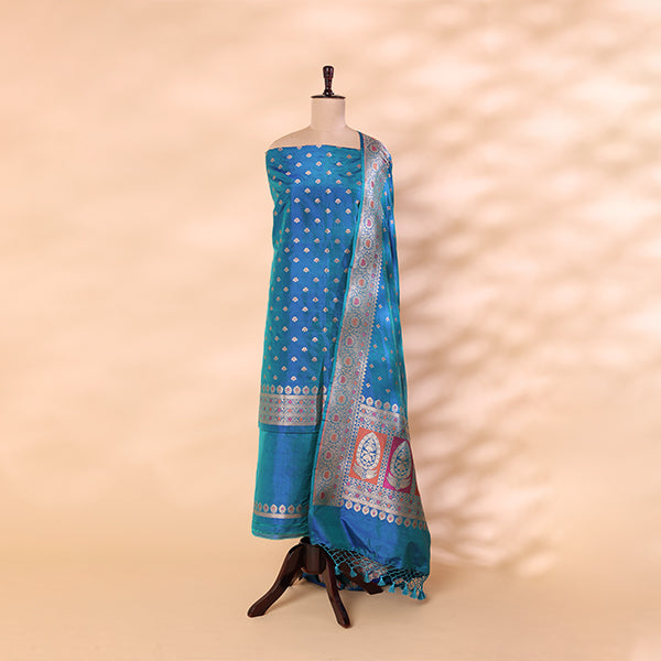 Aqua Blue handwoven Banarasi silk suit with intricate gold Zari and Meena work, displayed on a mannequin against a neutral background.
