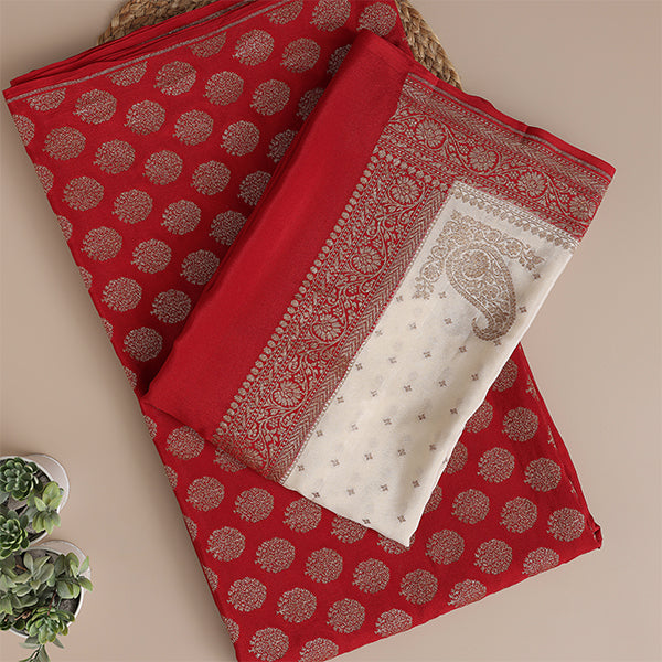 Arzo India Ruby Radiance crepe silk suit featuring traditional golden borders paired with a cream mist dupatta.