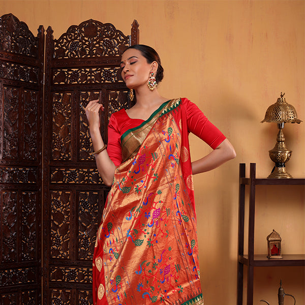 Front view of Arzo India's traditional green and red pure handwoven Paithani silk saree showcasing classic Maharashtrian style weaving.