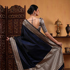 Model showcasing the Royal Blue Mashru Silk Saree with full jaal unstitched blouse by Arzo India.