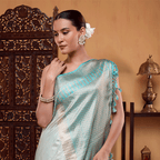 Close-up detail of the horizontal gold zari and resham border on the handwoven pure katan silk Aurora Borealis saree.