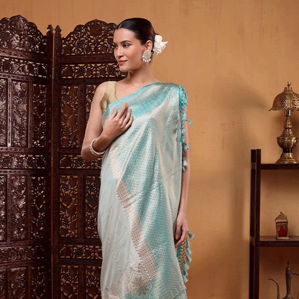 Unstitched un-dyed striped blouse fabric with matching border included with the Aurora Borealis Katan Silk Saree.