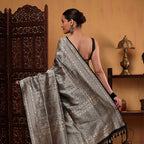 Detailed shot of the pure handwoven brocade silk fabric showcasing the intricate textures of the golden zari stripes