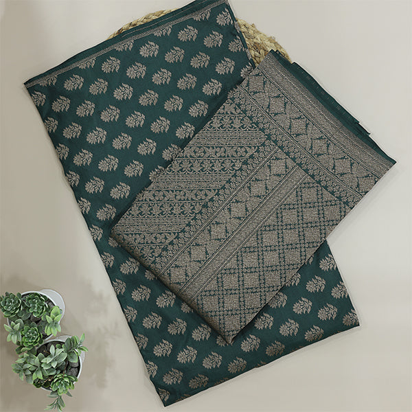 Close-up detail of the traditional full Jaal handwoven pattern on pure emerald green Jamawar silk fabric.