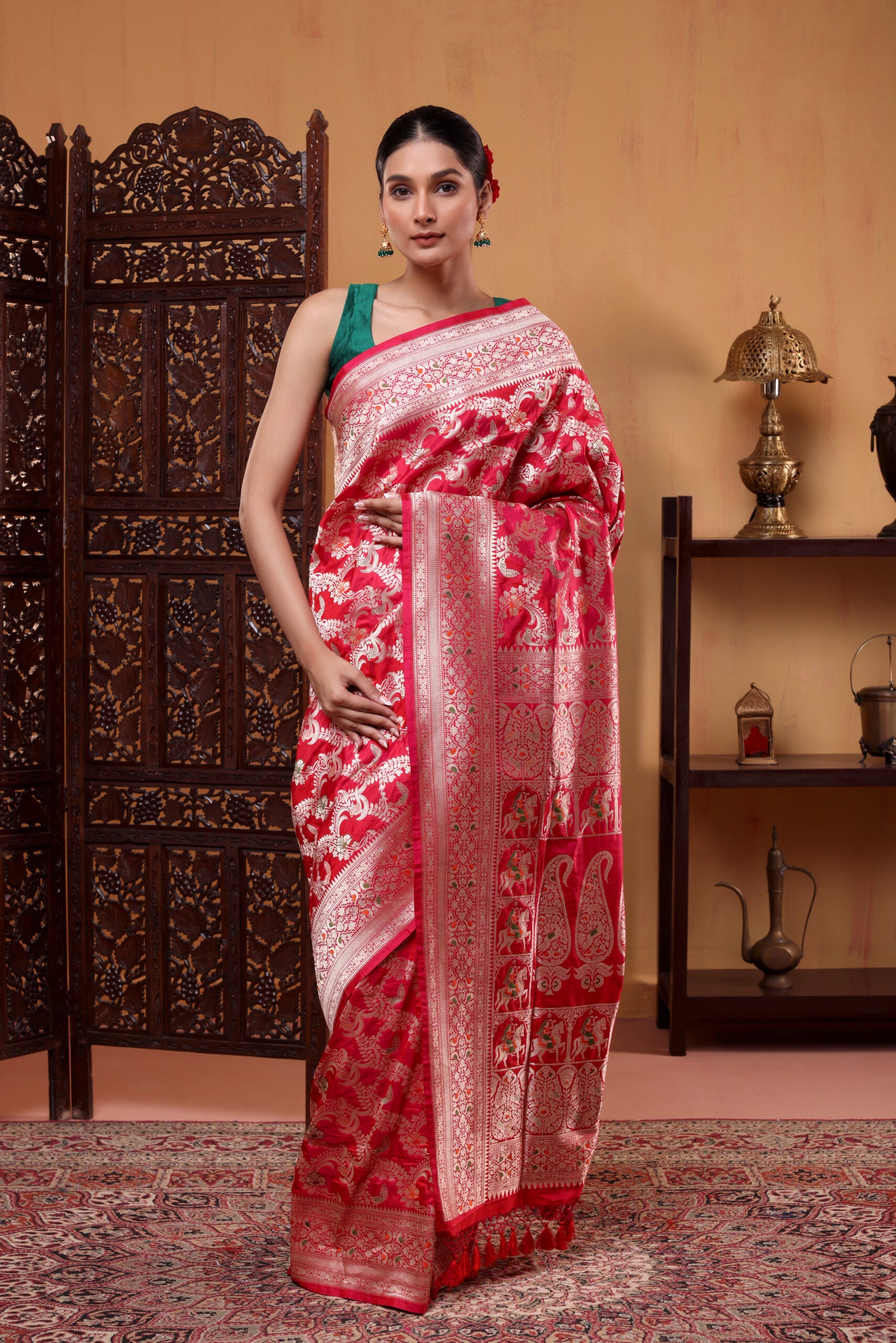 Close-up shot of the opulent Shikargah pallu with intricate traditional handweaving and detailed Meenakari craftsmanship.