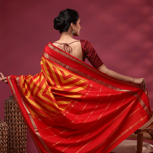 Close-up shot of the elegant double border on the radiant yellow pure Banarasi silk saree, highlighting traditional handloom craftsmanship.