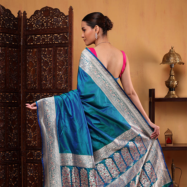 Close-up detail of the intricately woven Shikargah pallu with traditional motifs on the luxury azure blue katan silk saree.