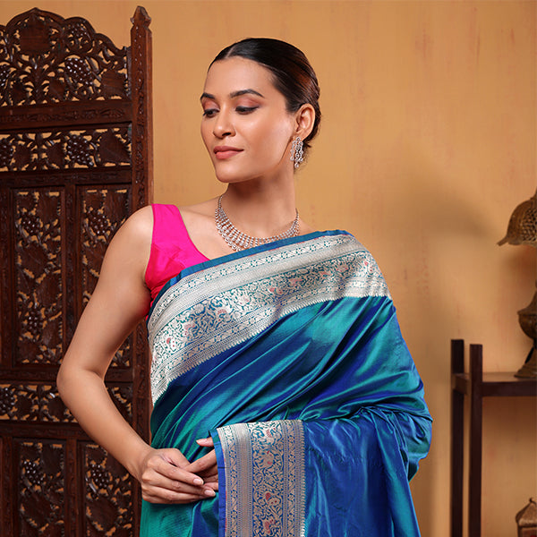 Unstitched blue azure katan silk blouse fabric featuring a full jaal weave and matching gold border.