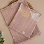 Close-up detail of the handwoven crushed georgette fabric and fine blended Zari embroidery on the blush pink Banarasi suit.