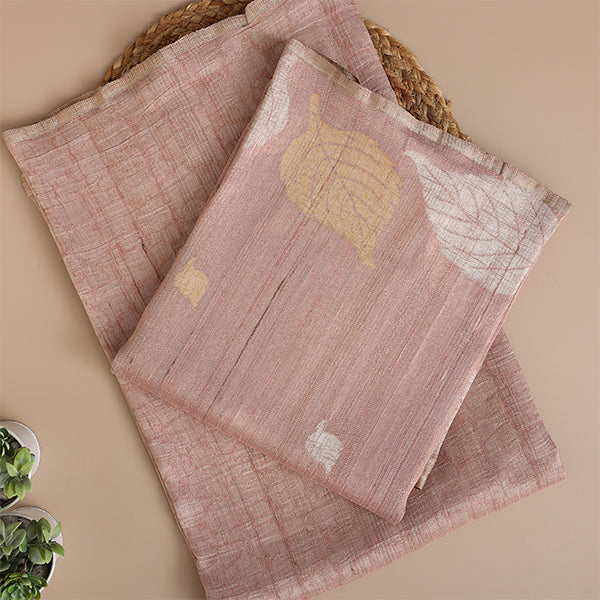 Close-up detail of the handwoven crushed georgette fabric and fine blended Zari embroidery on the blush pink Banarasi suit.