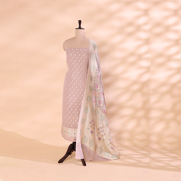Blush Radiance unstitched suit fabric in pure light pink georgette silk styled on a mannequin, paired with a vibrant multicolored melody dupatta featuring rich traditional craftsmanship.