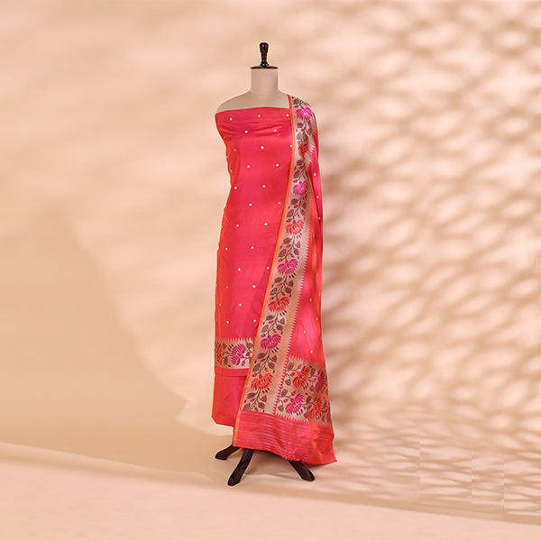 Blushing Rose unstitched suit fabric in handwoven Katan silk styled on a mannequin, featuring a matte pink base with gold bootas and a vibrant multi-colored Paithani border dupatta.