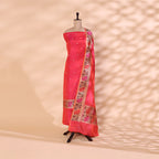 Blushing Rose unstitched suit fabric in handwoven Katan silk styled on a mannequin, featuring a matte pink base with gold bootas and a vibrant multi-colored Paithani border dupatta.