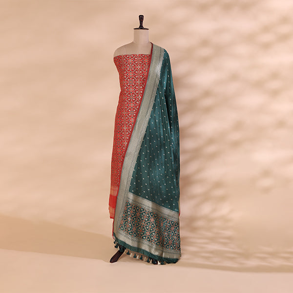 Detailed view of the vibrant carrot red fiery ember multicoloured dupatta showcasing traditional Patola and Banarasi weaving craftsmanship.