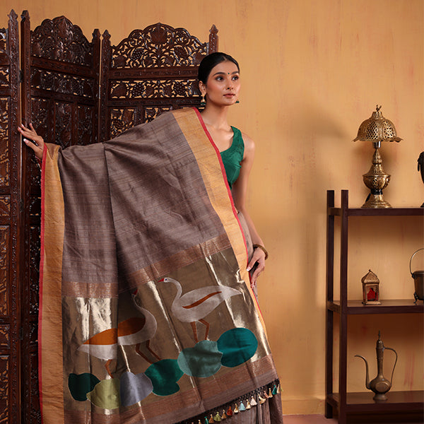 Front drape view of the Coffee Elegance silk saree highlighting the handwoven pleat structure and the rich contrasting zari border.