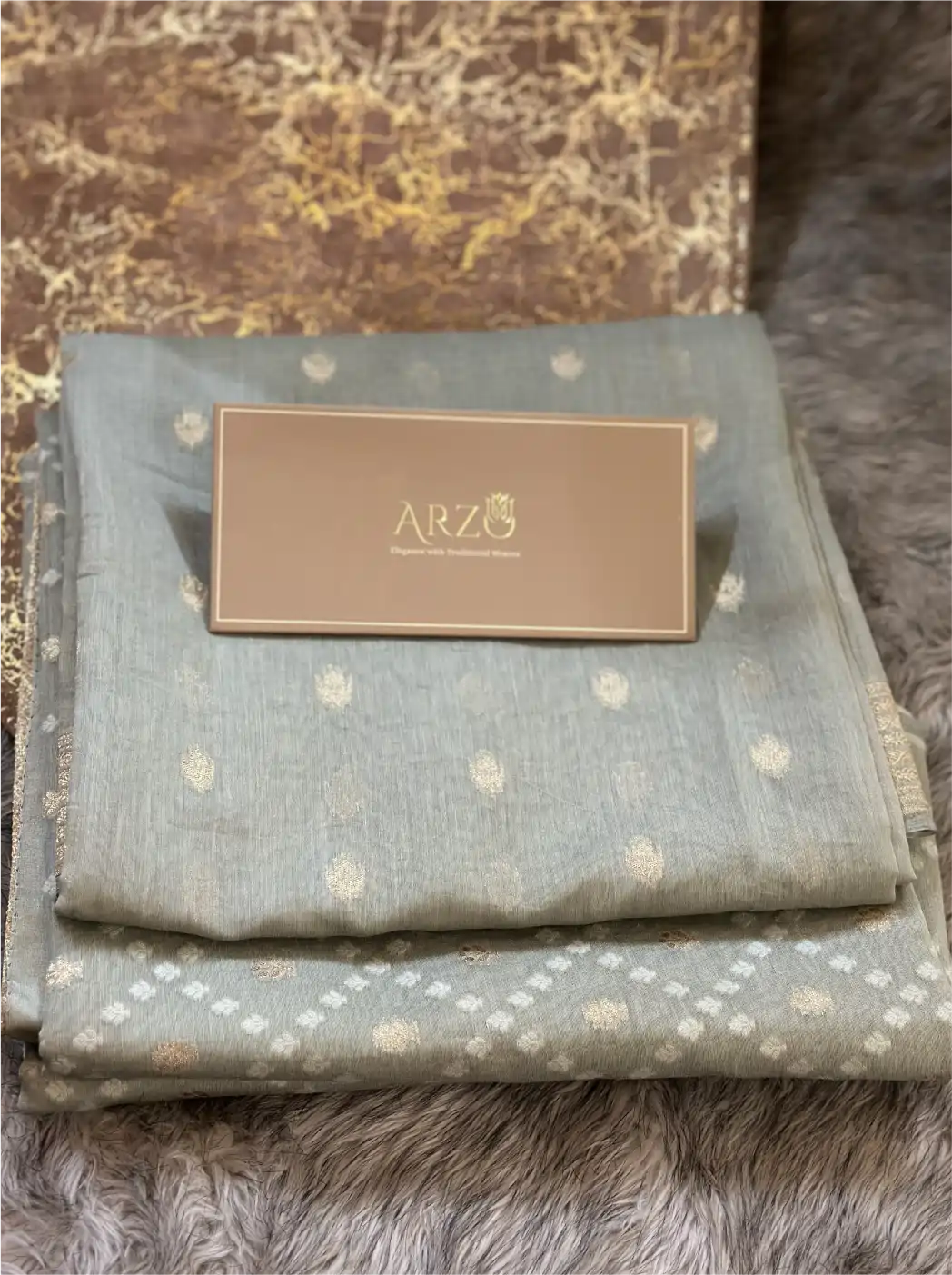 Close-up texture view of the premium breathable gray cotton suit fabric, showcasing the fine handloom style weave and pattern details.