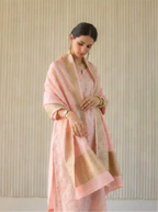 Detailed close-up shot highlighting the lightweight, breathable pink cotton fabric weave and zari border details.