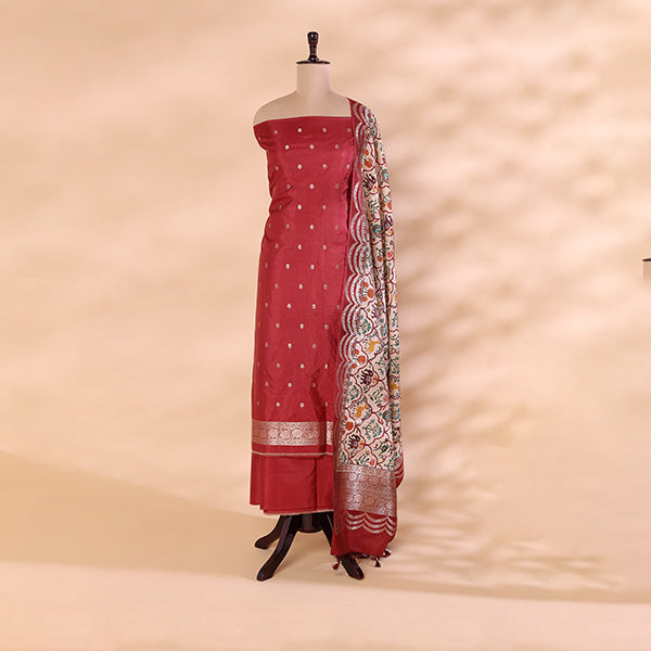 Crimson Elegance unstitched suit fabric in pure handwoven Banarasi silk with a vibrant red base, beautifully styled with a digital Kalamkari print dupatta on a mannequin.