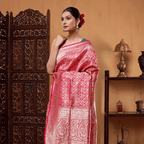 Front view of the Crimson Shikargah Splendor silk saree highlighting the handwoven gold zari pleats and detailed lower border.