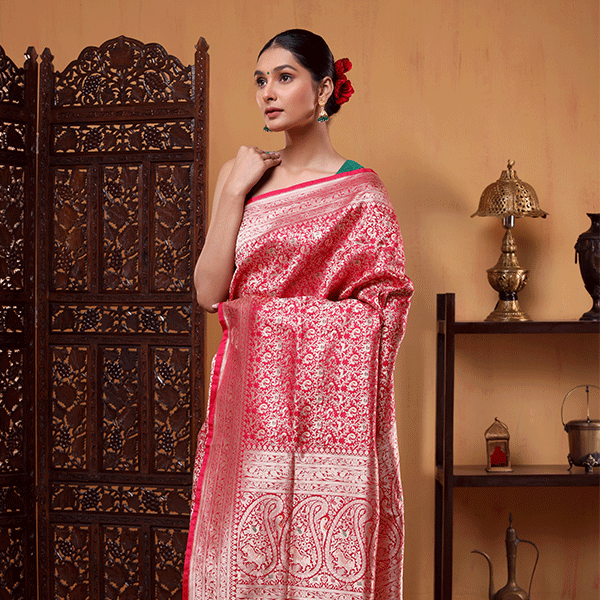 Front view of the Crimson Shikargah Splendor silk saree highlighting the handwoven gold zari pleats and detailed lower border.