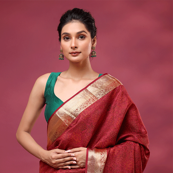 Front drape view of the Celestial Dawn silk saree highlighting the clean handwoven gold zari work on the pleats and lower border.