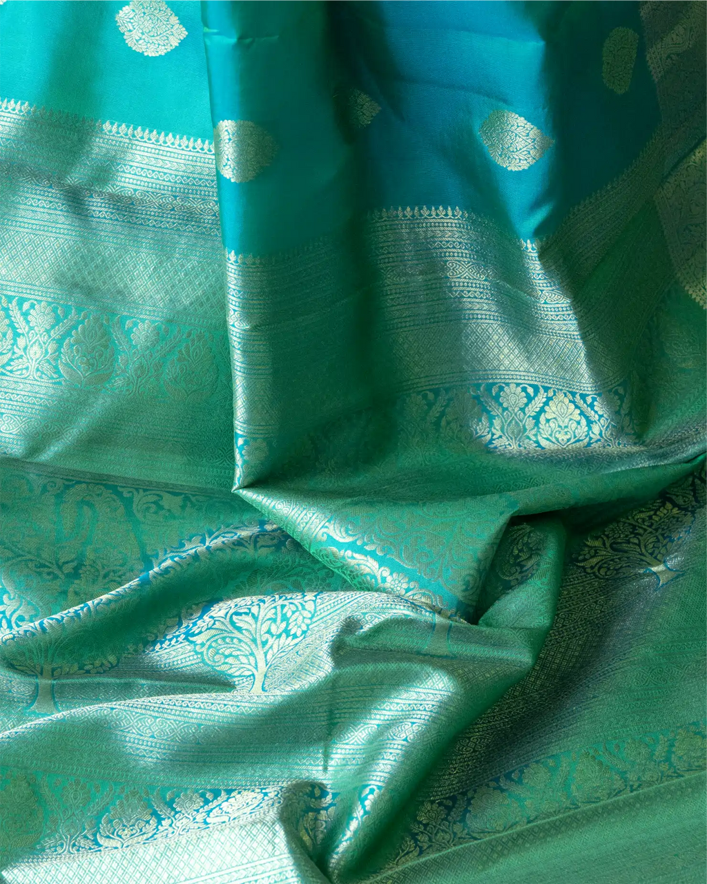 A close-up showing the luxurious, lustrous natural sheen and texture of the premium pure silk fabric.