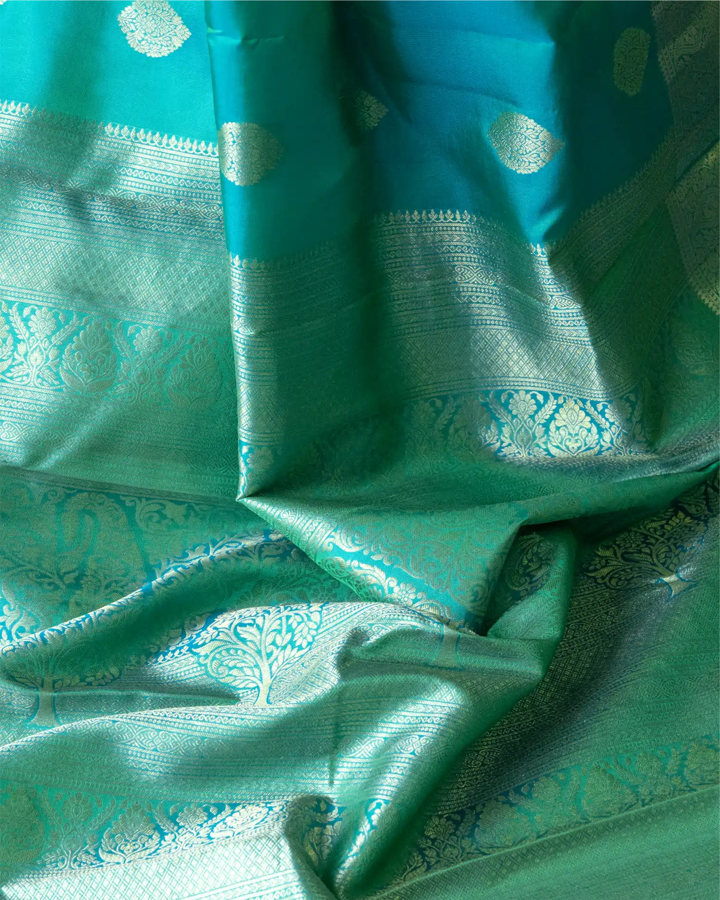 A close-up showing the luxurious, lustrous natural sheen and texture of the premium pure silk fabric.