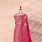 Premium deep pink and magenta Banarasi silk suit fabric paired with an elegant draped zari border dupatta.