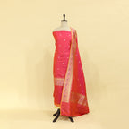Ember Radiance handwoven Katan silk unstitched suit featuring a fiery ember matte base and a multicolored dupatta with a rich Paithani border on a mannequin.