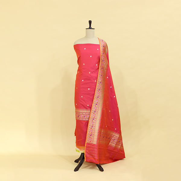 Ember Radiance handwoven Katan silk unstitched suit featuring a fiery ember matte base and a multicolored dupatta with a rich Paithani border on a mannequin.
