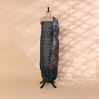 Enchanted Emerald Green Banarasi silk unstitched suit material with intricate full Jaal handwoven design displayed on a mannequin.