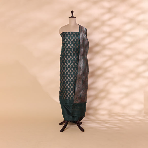 Enchanted Emerald Green Banarasi silk unstitched suit material with intricate full Jaal handwoven design displayed on a mannequin.