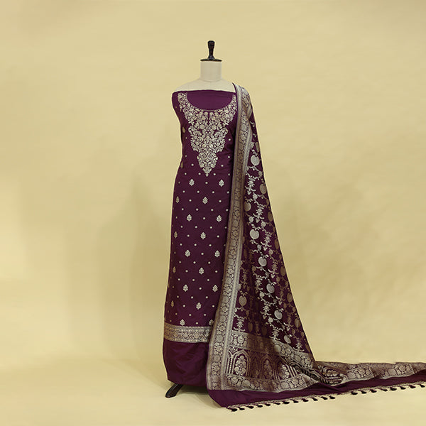 Enchanted Maroon Banarasi Silk Suit unstitched dress material draped beautifully on a mannequin, showcasing its luxurious deep maroon hue and elegant drape.