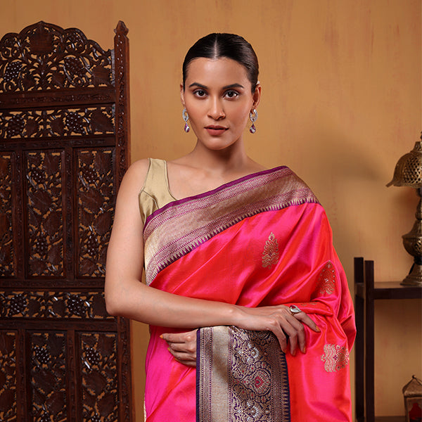 Back view of the handwoven Fuchsia Fantasy katan silk saree showcasing the four-sided vibrant pink border and elegant drape.