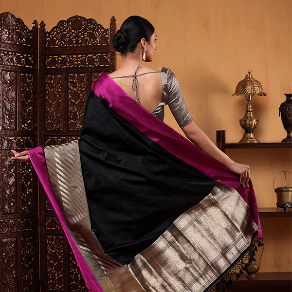 Close-up detail of the handwoven Banarasi zari and resham stripes on pure fuchsia satin silk fabric.