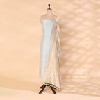 Unstitched handwoven pure Katan silk suit material in gleaming sky blue with a lustrous silver border, styled on a mannequin with a golden sunlit dupatta.