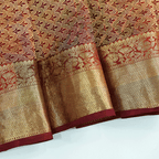 Flat lay view of the unstitched premium gold full Jaal blouse material with a matching border included with the Celestial Dawn Silk Saree.
