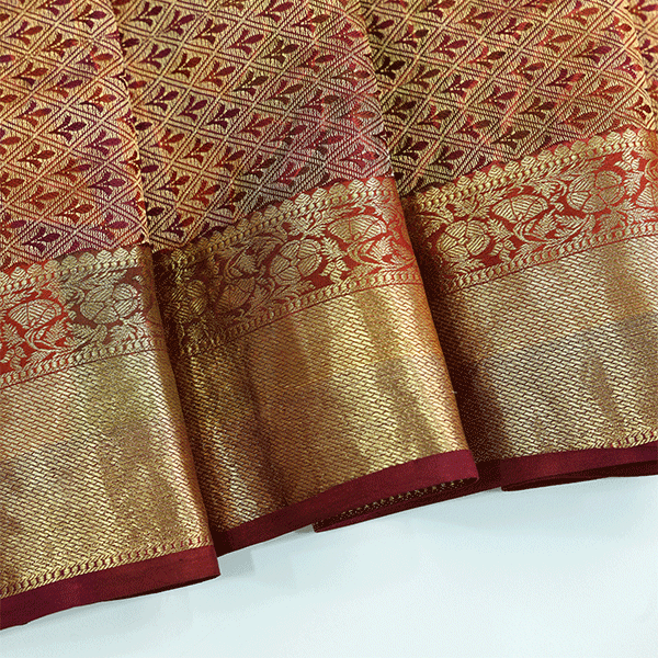 Flat lay view of the unstitched premium gold full Jaal blouse material with a matching border included with the Celestial Dawn Silk Saree.
