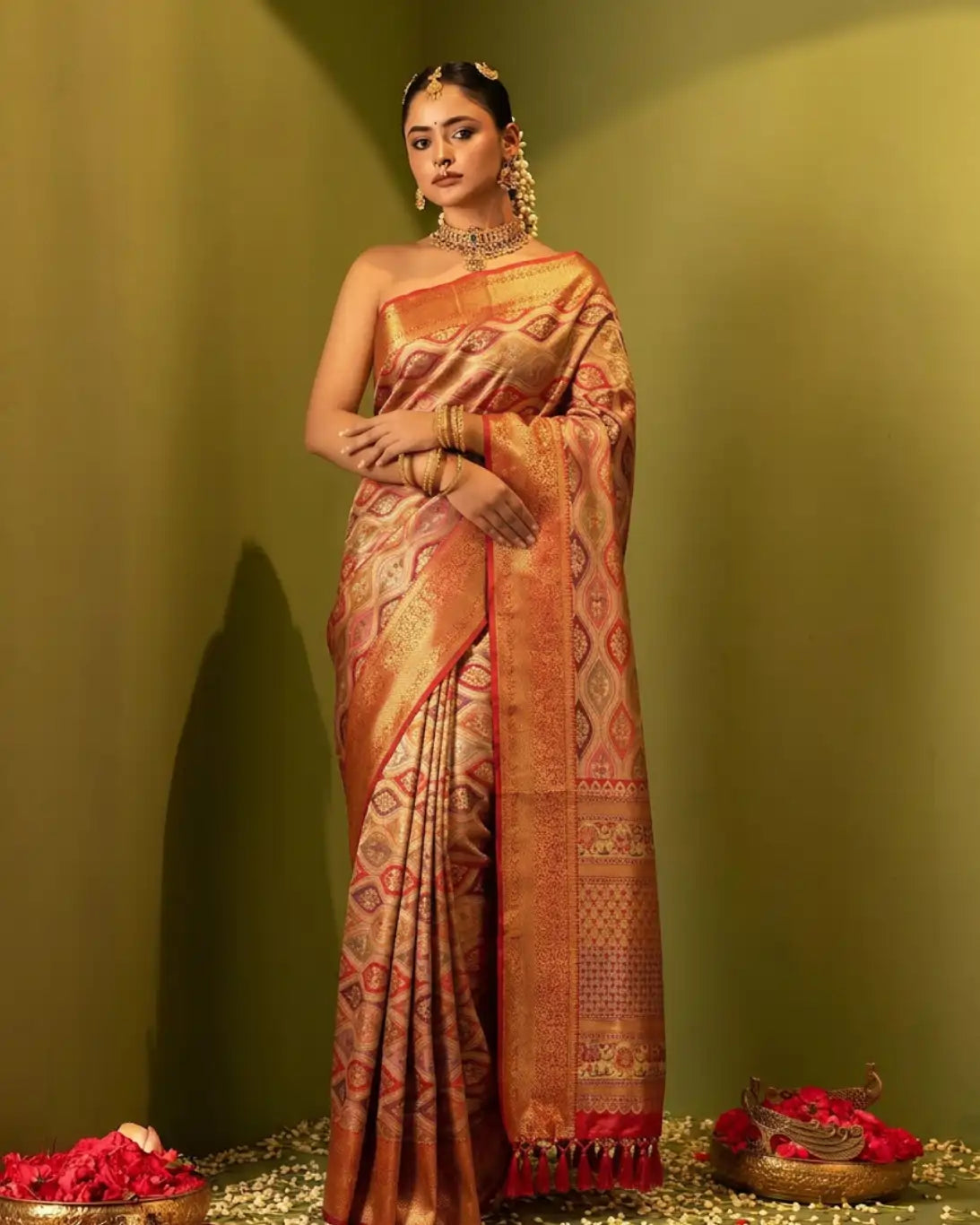 Handwoven gold and coral orange Rangkaat Kanchipuram silk saree for bridal and festive wear.