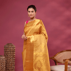 Detailed view of the luxurious heavy pallu featuring traditional handwoven patterns on the golden mustard Kanjivaram silk saree.