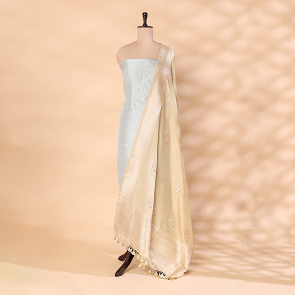 Detailed view of the premium golden sunlit dupatta featuring exquisite handloom weaving and traditional artistic motifs, paired with the sky blue suit.