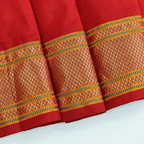 Close-up texture shot of the premium pure handwoven Paithani silk fabric, showcasing the fine weave quality and authentic metallic zari details.