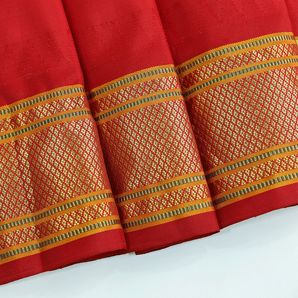 Close-up texture shot of the premium pure handwoven Paithani silk fabric, showcasing the fine weave quality and authentic metallic zari details.